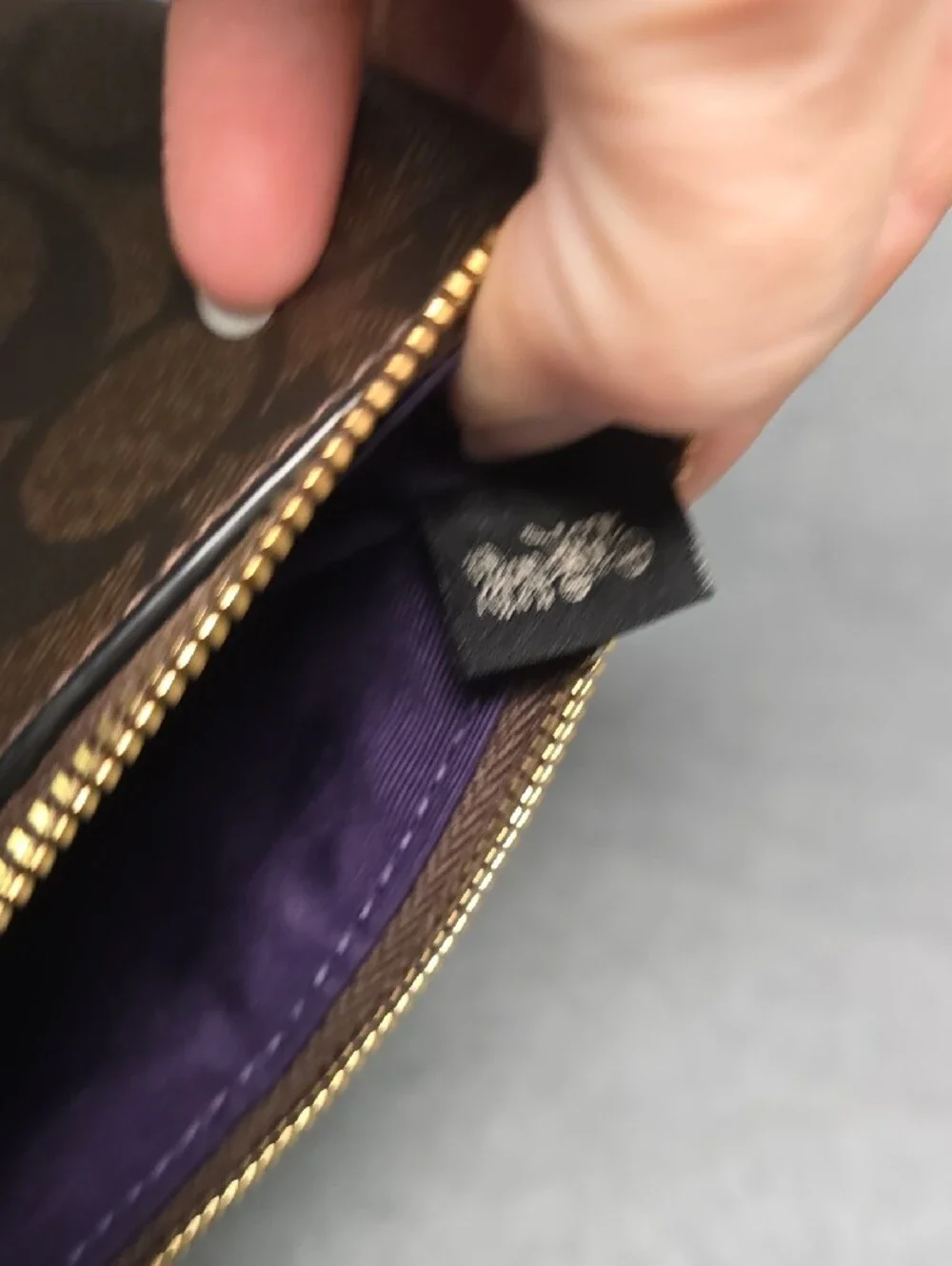 Coach Brown Signature Coated Canvas Wristlet with Purple Leather Center Stripe